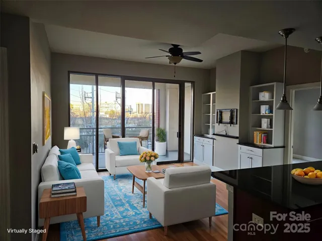 Living Room looking out to sliding glass door and the 25' X 8' Balcony VS