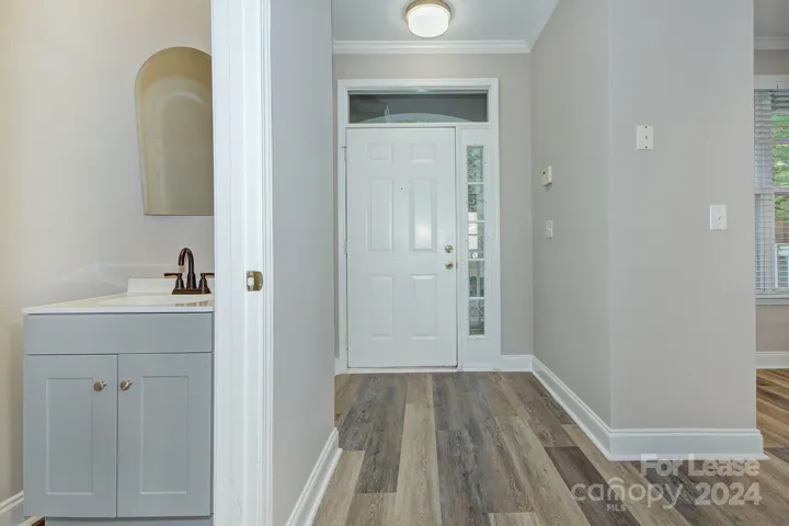 Front Entry with coat closet and powder room