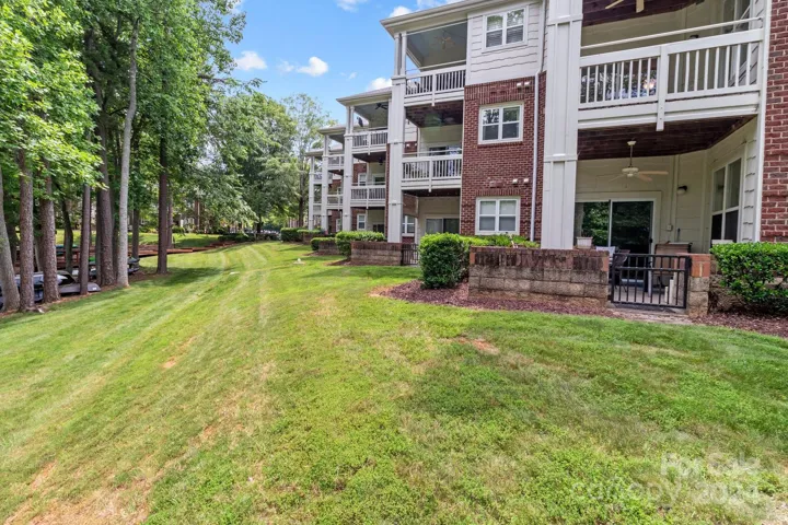 Building is surrounded by mature trees.