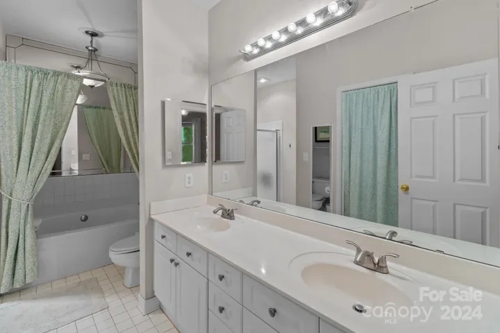 Dual vanities, garden tub , stall shower and walk-in  closet