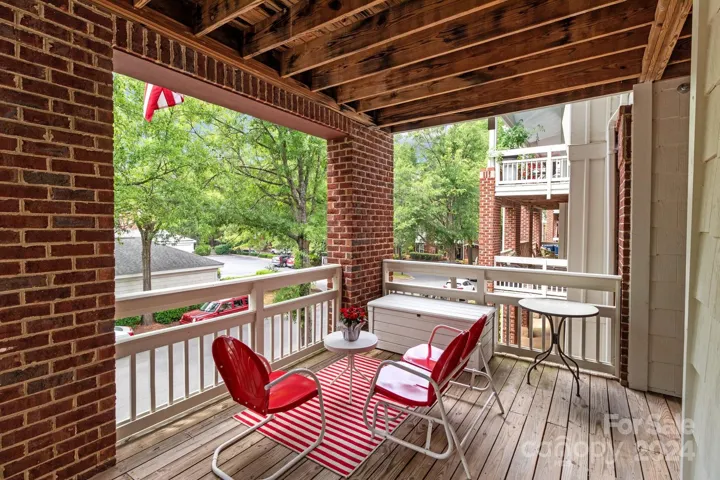 Entrance to this condo is an open and spacious front porch.