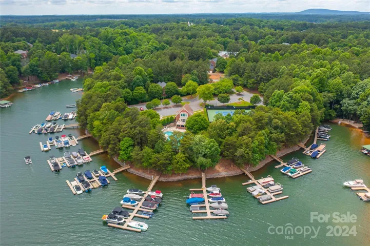 Areial of the Community Pool, Clubhouse, Tennis/pickleball Courts and boatslips