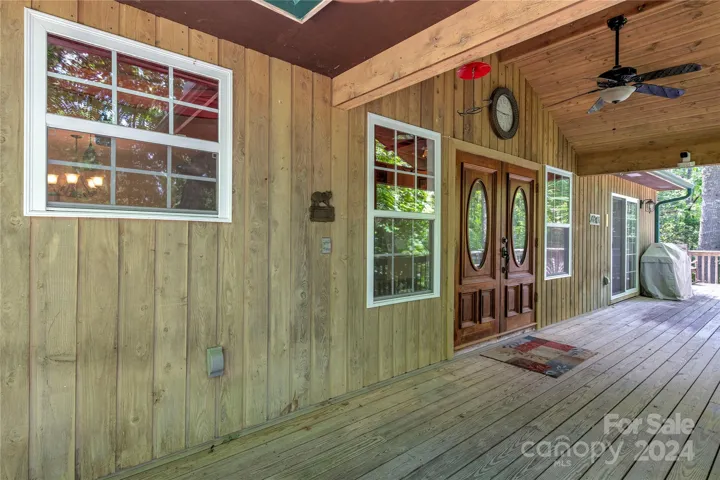Enter the home through French doors from a long, partially covered, front porch.