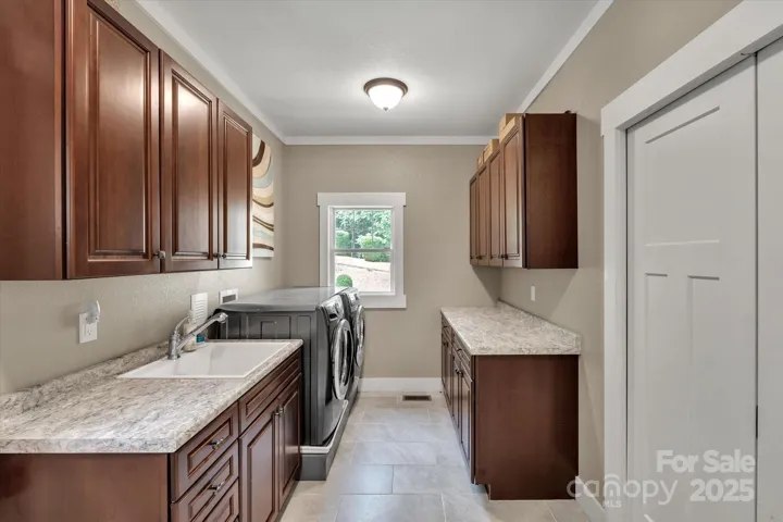 Large laundry room with access outside.