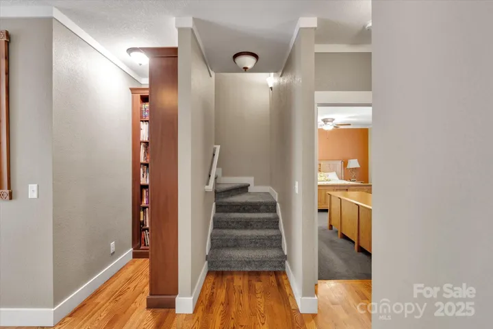 Reading nook, stairs to upper level & door to primary bedroom