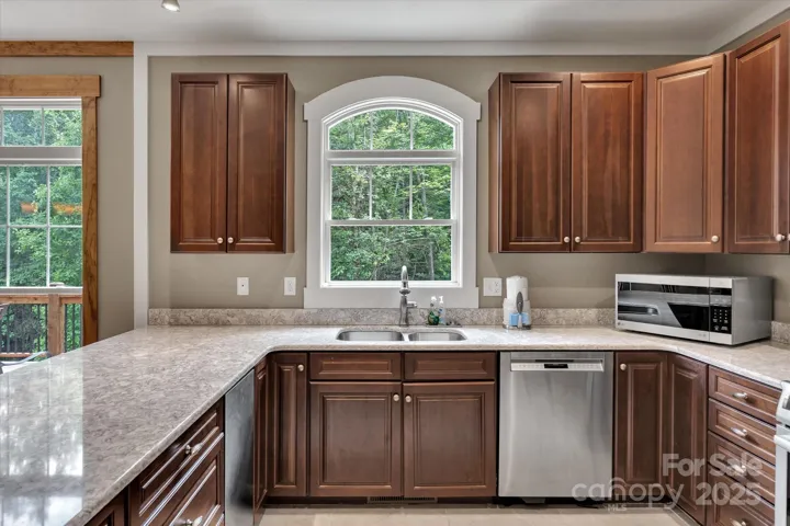 Kitchen overlooks the private backyard.