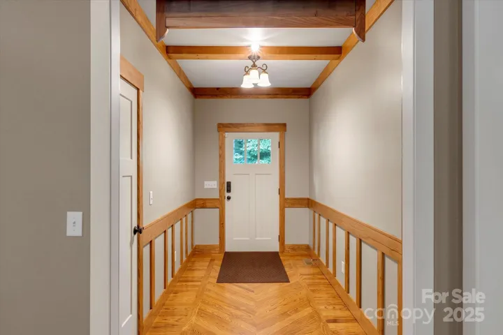 Welcoming entry with custom woodwork