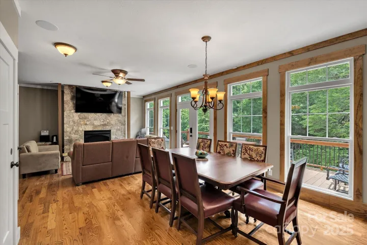Ample dining area opens onto rear deck.