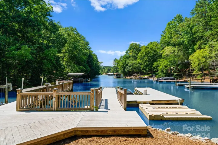 Floating dock with boat lift, jet ski ramp, and grandfathered launch