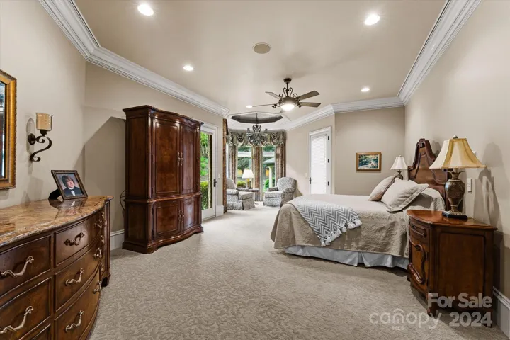 Main level primary with sitting area and private outdoor patio