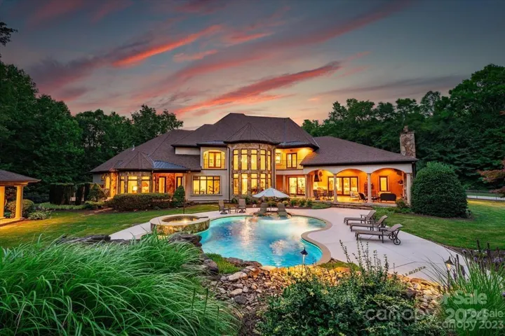 Backyard oasis surrounding by lush landscaping