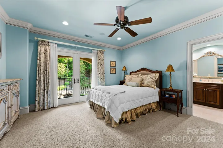 Guest bedroom w/ walk-in closet and private balcony