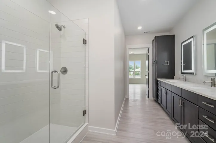 Primary bathroom has large frameless shower!