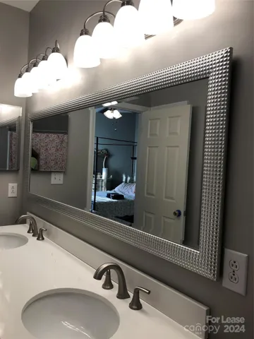 New lights and quartz top vanity in Masterbath