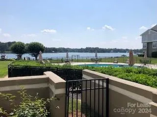 First Floor walk out gated patio w/garden