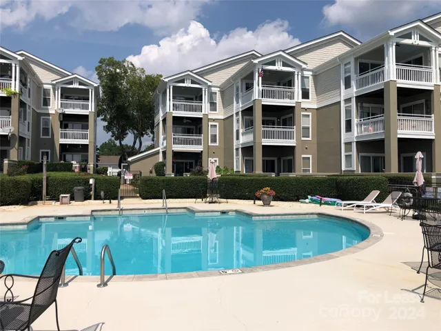 First floor garden patio unit overlooking pool and lake.