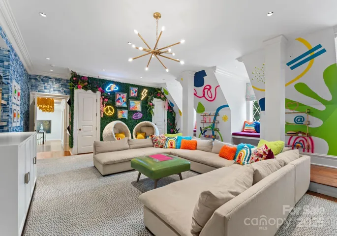 Large game room/play room with full bathroom and secret art studio space