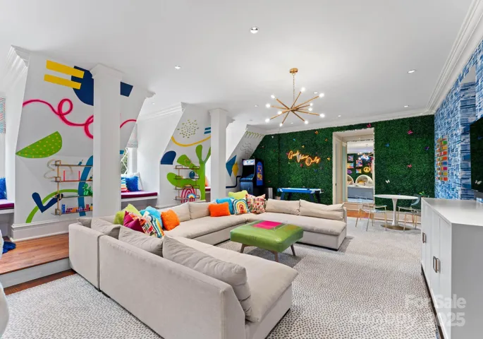 Award winning playroom with custom mural, faux fern and bowood walls.