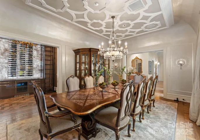 Dining room with custom butlers pantry. Signature hand crafted trim work throughout.
