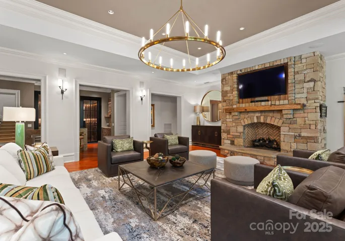 Living area includes fireplace- stone with wood mantle and custom Furniture