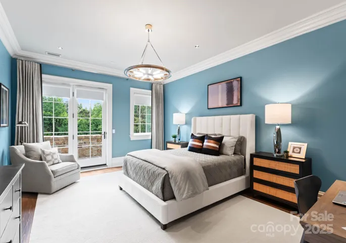 Secondary bedroom offers a large terrace overlooking the backyard oasis.