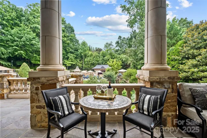 Large outdoor covered terrace overlooking the backyard oasis.