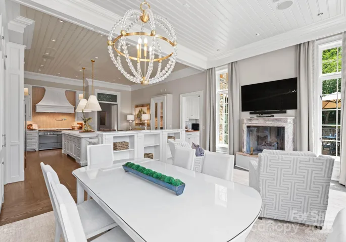 Kitchen offers a casual dining area with large table and chairs.