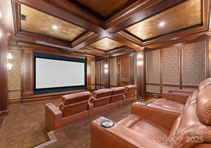 Theater room with projector and screen system.