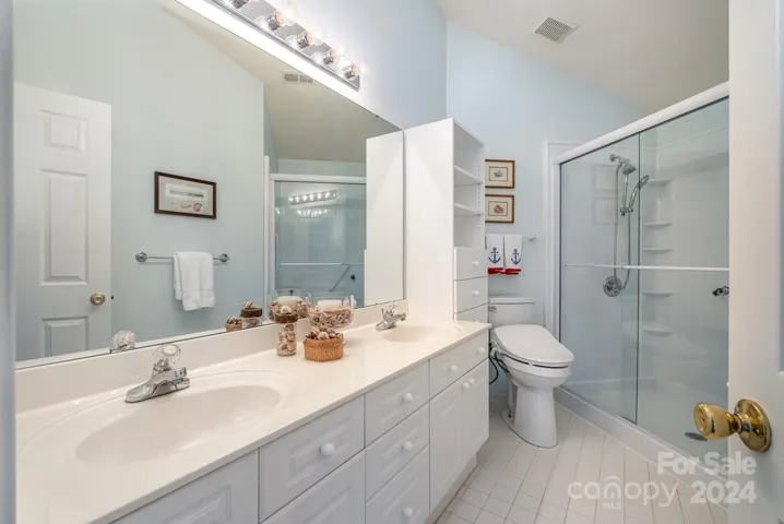 Double sinks and a large shower