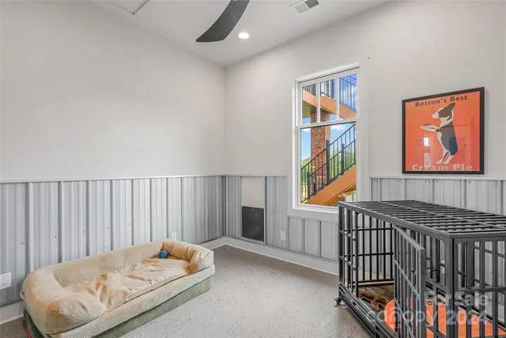Bonus room off of Kitchen with a dog door out to the fenced yards behind the home.