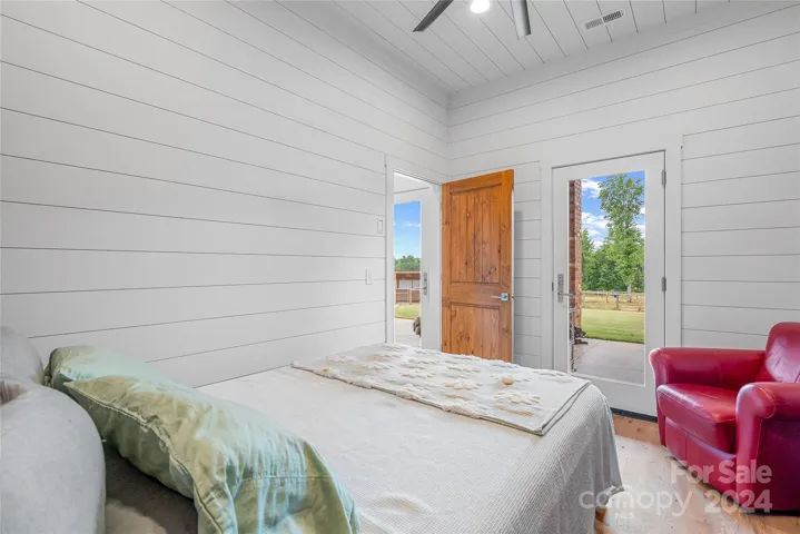 Guest bedroom has its own exterior door.