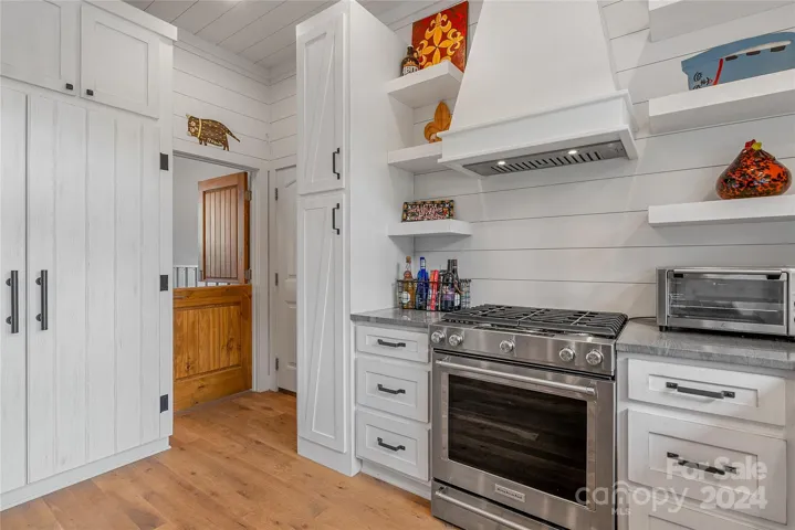 Dutch door leads to a bonus room with a dog door out to the fenced back yard areas. Soft close cabinets.