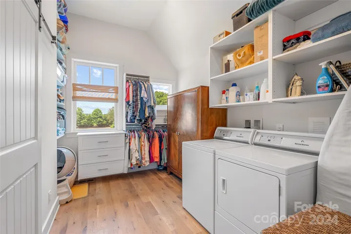 Spacious walk in closet and laundry room.