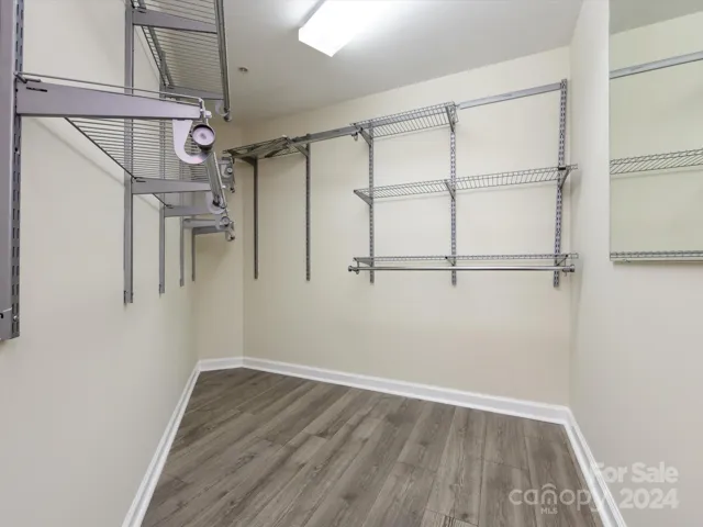 Primary bedroom walk in closet