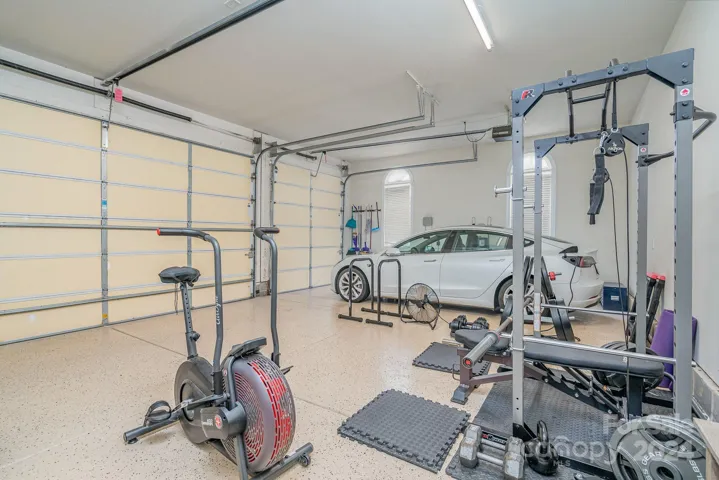 3 car garage with epoxy floors and insulated doors.