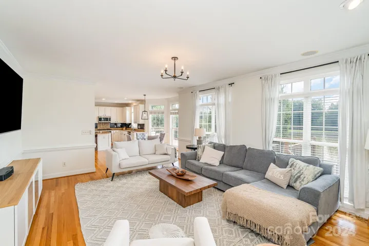 Great room is open to the kitchen, and those windows look out over the lake!