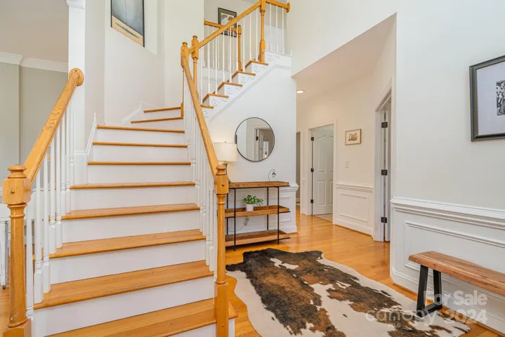 Open foyer with elegant front staircase.