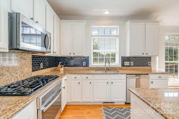 Beautiful light and airy kitchen with lots of counter space and plenty of cabinets