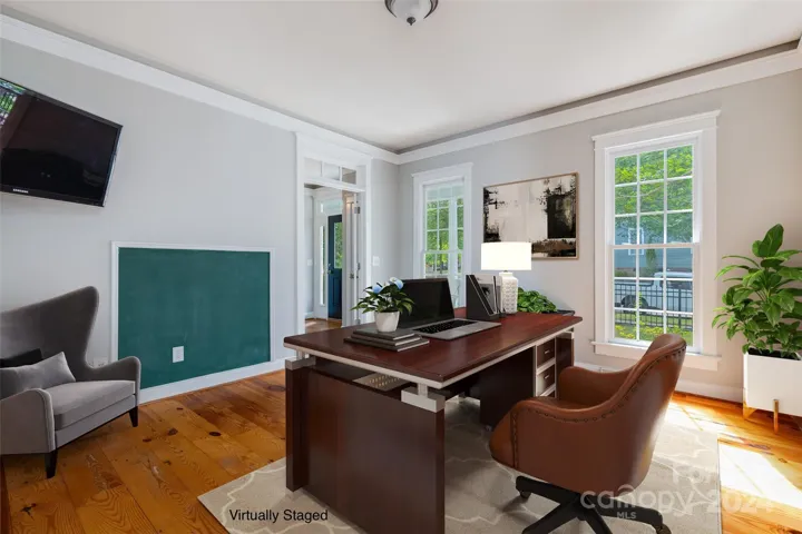 Virtually staged 2nd view of office.