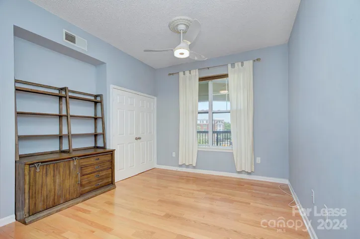 Flex room great for office or storage with ceiling fan and refinished wood floors