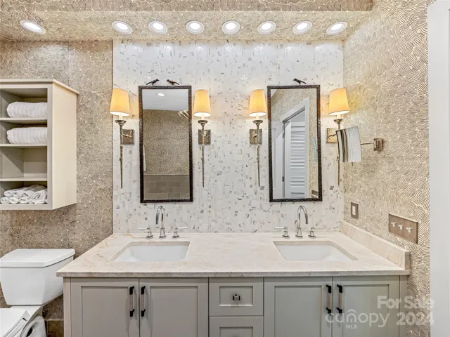 Primary bathroom features dual vanity, garden tub and walk-in shower