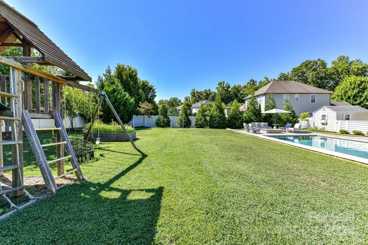 Expansive Back Yard with lush landscaping & gorgeous Pool/Spa!