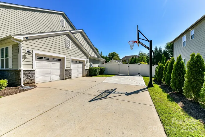 2 Car, Side Load Garage & Extended Parking Pad!