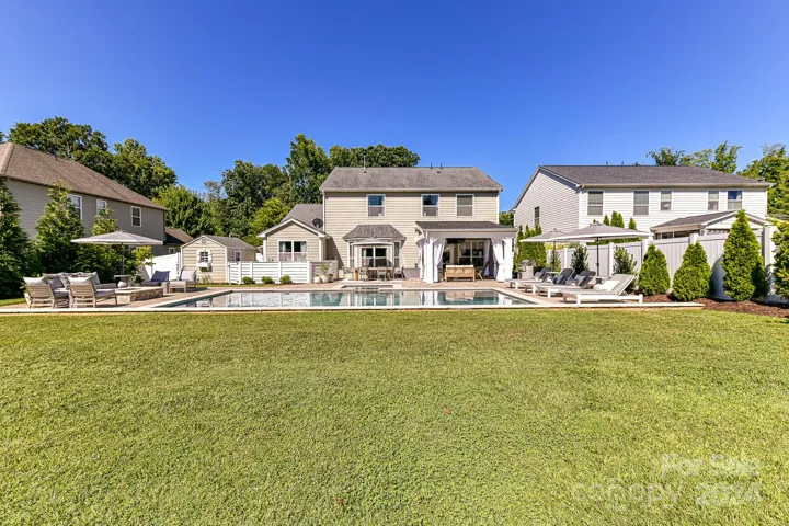 Exterior Back of Home with Outdoor Oasis!