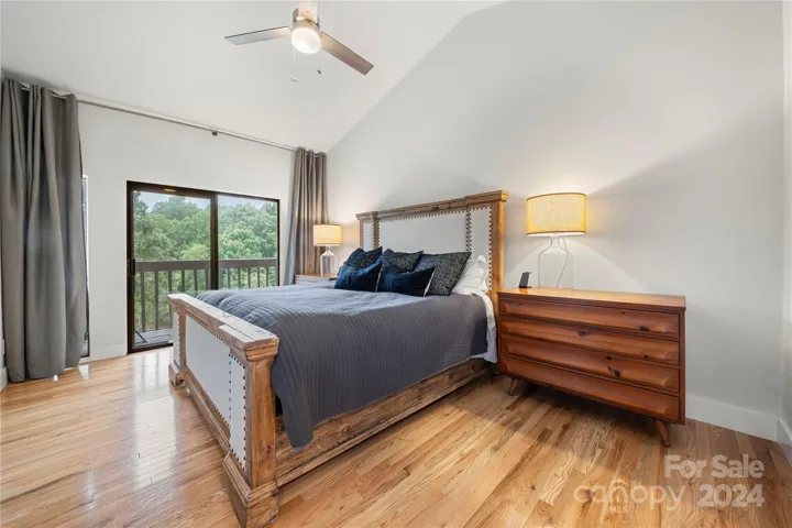 Primary Bedroom with Balcony looking over the lake