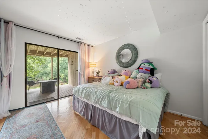 Lower level bedroom with own porch looking over the lake