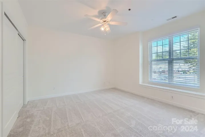 Primary bedroom with new carpet!