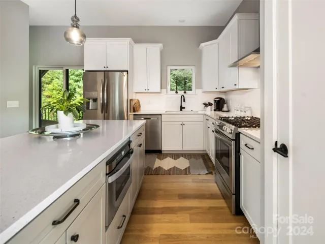 A built-in microwave (the drawer slides in and out), a natural gas range and plenty of storage