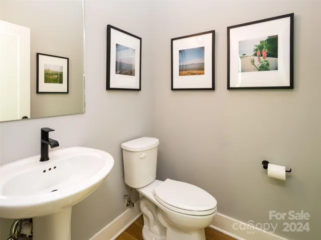 The powder room is well placed -  around the corner from the kitchen