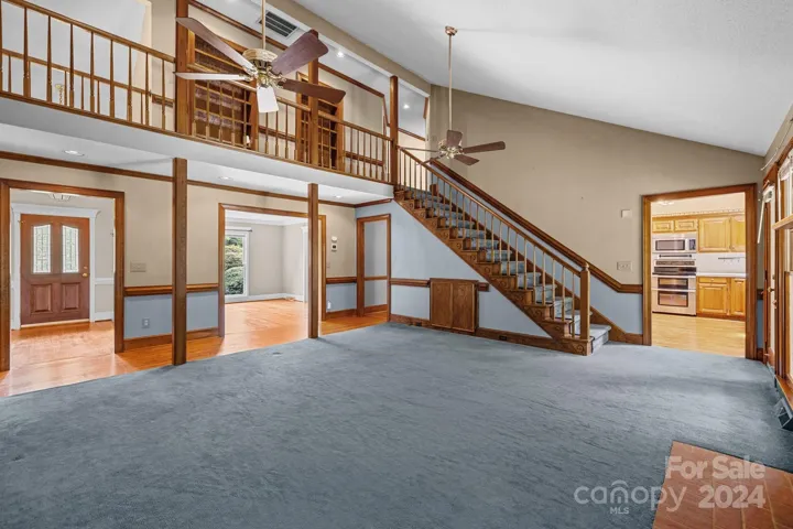 Upstairs balcony with solid wood builtins overlooks the Living Room